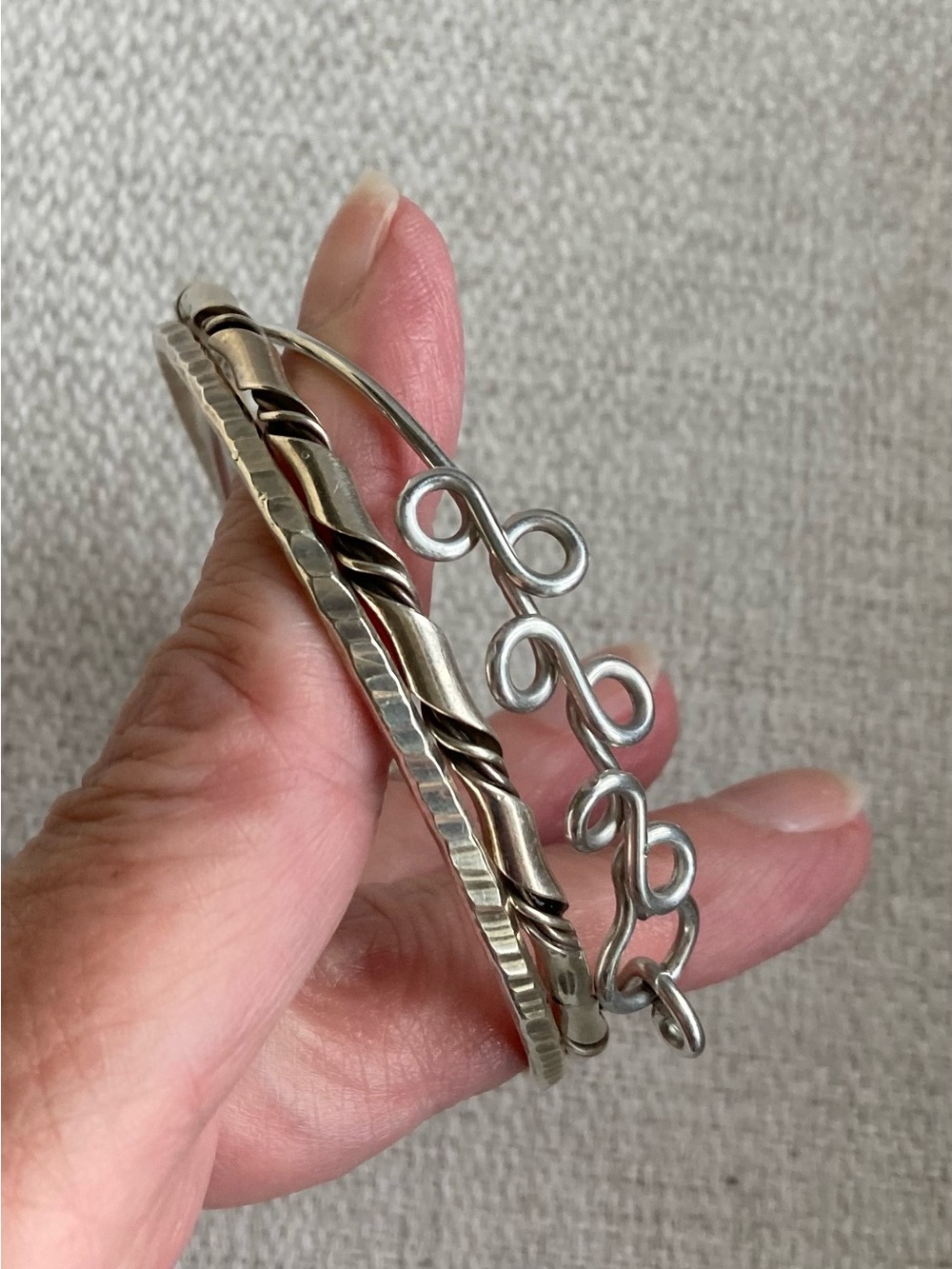 Three Metallic Bracelets in Various Designs
